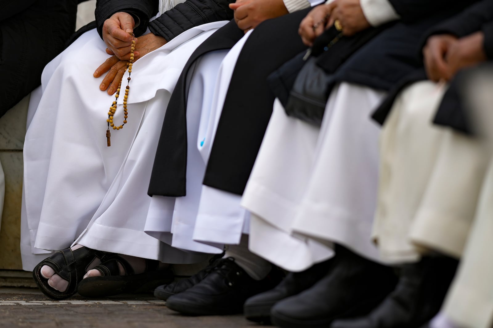 Nuns pray for Pope Francis in front of the Agostino Gemelli Polyclinic, in Rome, Thursday, Feb. 27, 2025, where the Pontiff is hospitalized since Friday, Feb. 14. (AP Photo/Andrew Medichini)