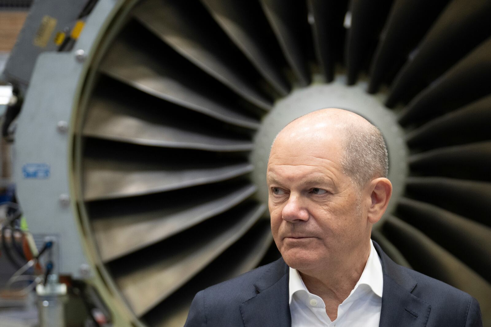 German Chancellor Olaf Scholz speaks during a visit to the company MTU Maintenance Berlin-Brandenburg in his constituency, Ludwigsfelde, Germany, Tuesday, Jan. 7, 2025. (Christoph Gollnow/dpa via AP)