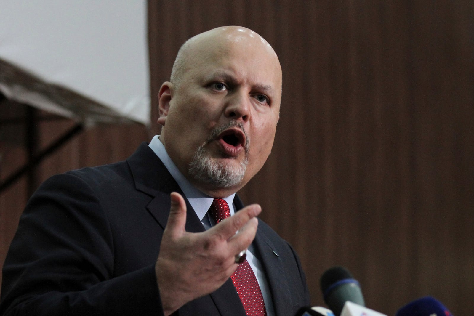 FILE - Karim Ahmed Khan, International Criminal Court chief prosecutor, speaks during a news conference at the Ministry of Justice in the Khartoum, Sudan, Aug. 12, 2021. (AP Photo/Marwan Ali, File)