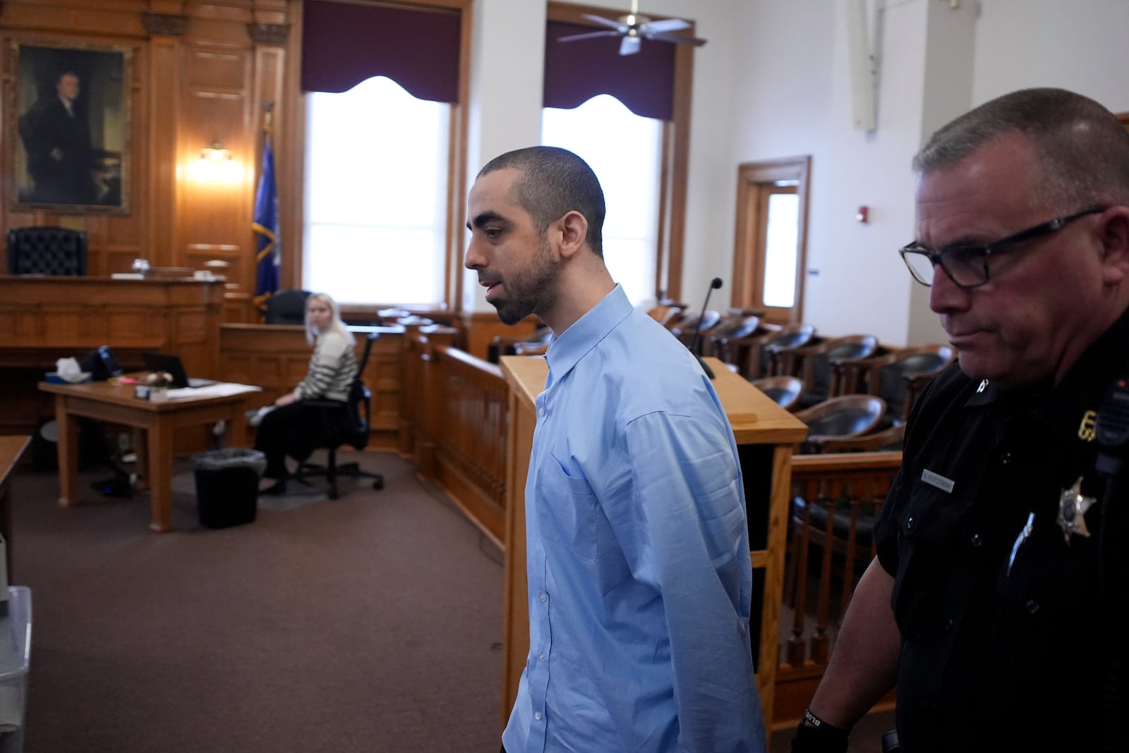 Hadi Matar is escorted into the courtroom at the Chautauqua County Courthouse ahead of the second day in his trial, Tuesday, Feb. 11, 2025, in Mayville, N.Y. Matar is charged with stabbing famed author Salman Rushdie. (AP Photo/Gene J. Puskar)