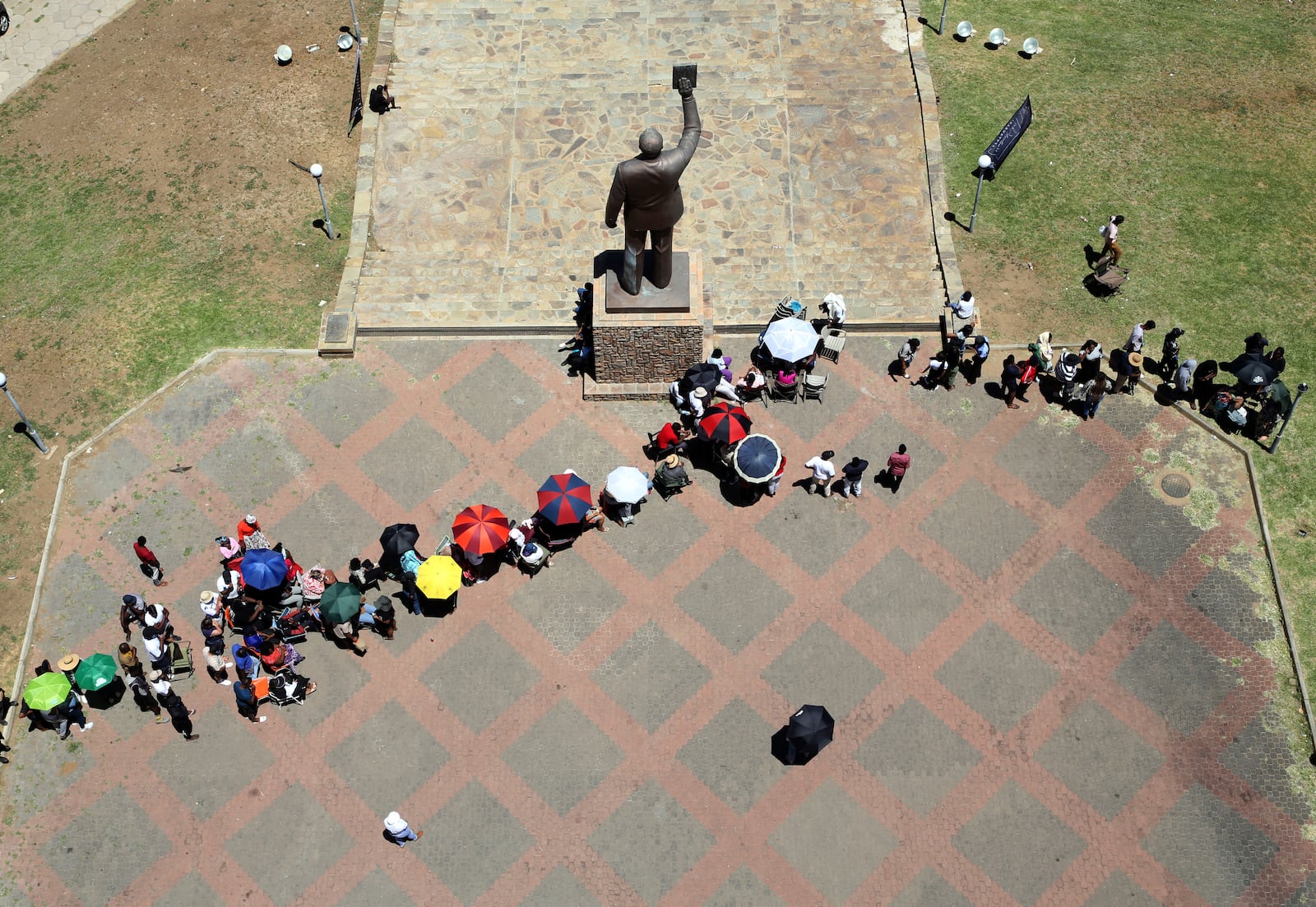 Namibians queue to cast their votes in presidential elections in Windhoek, Namibia, Wednesday, Nov. 27, 2024. (AP Photo/Dirk Heinrich)