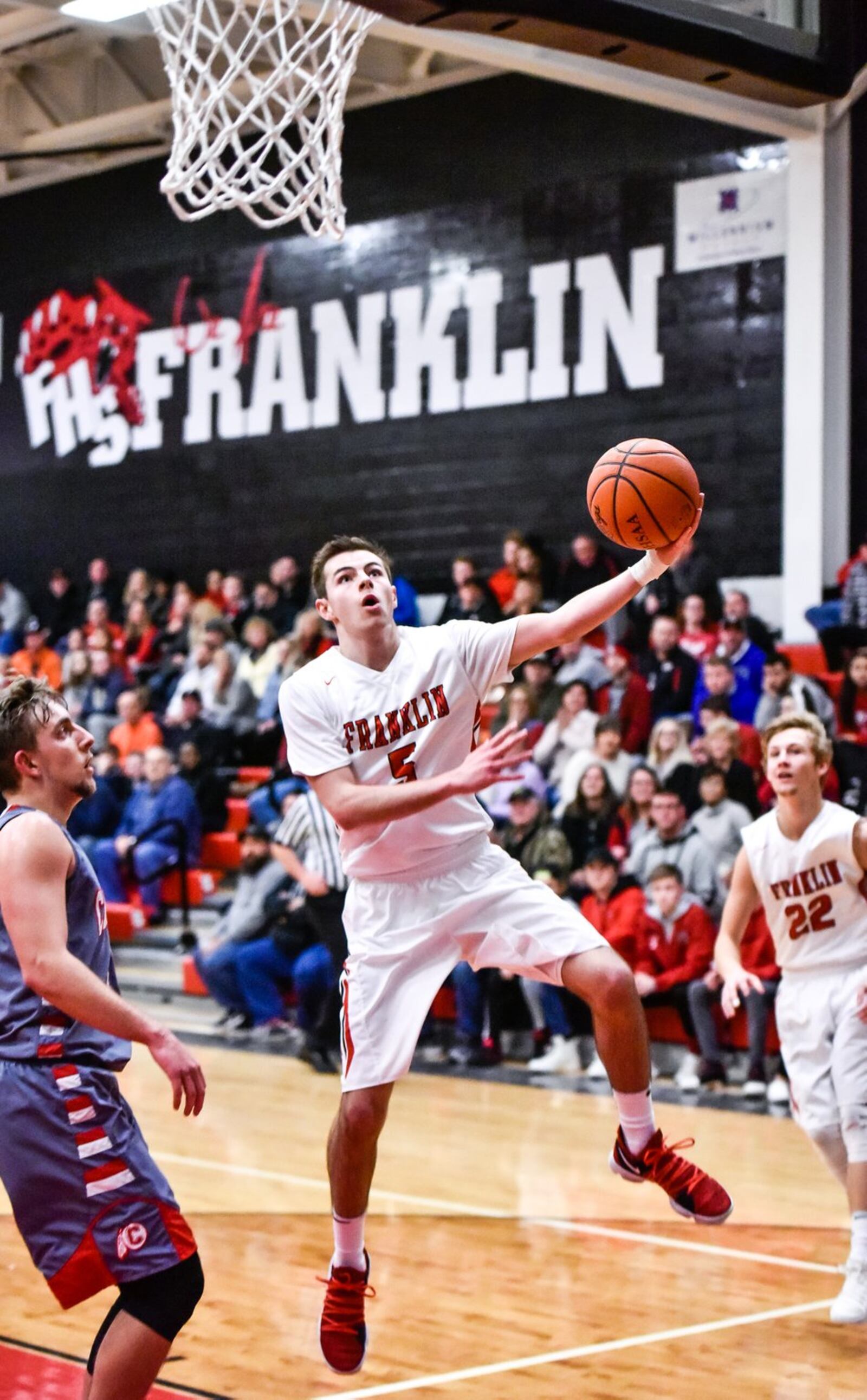 Franklin’s Cole Bundren heads to the basket during Tuesday night’s game against Carlisle at Darrell Hedric Gym in Franklin. NICK GRAHAM/STAFF