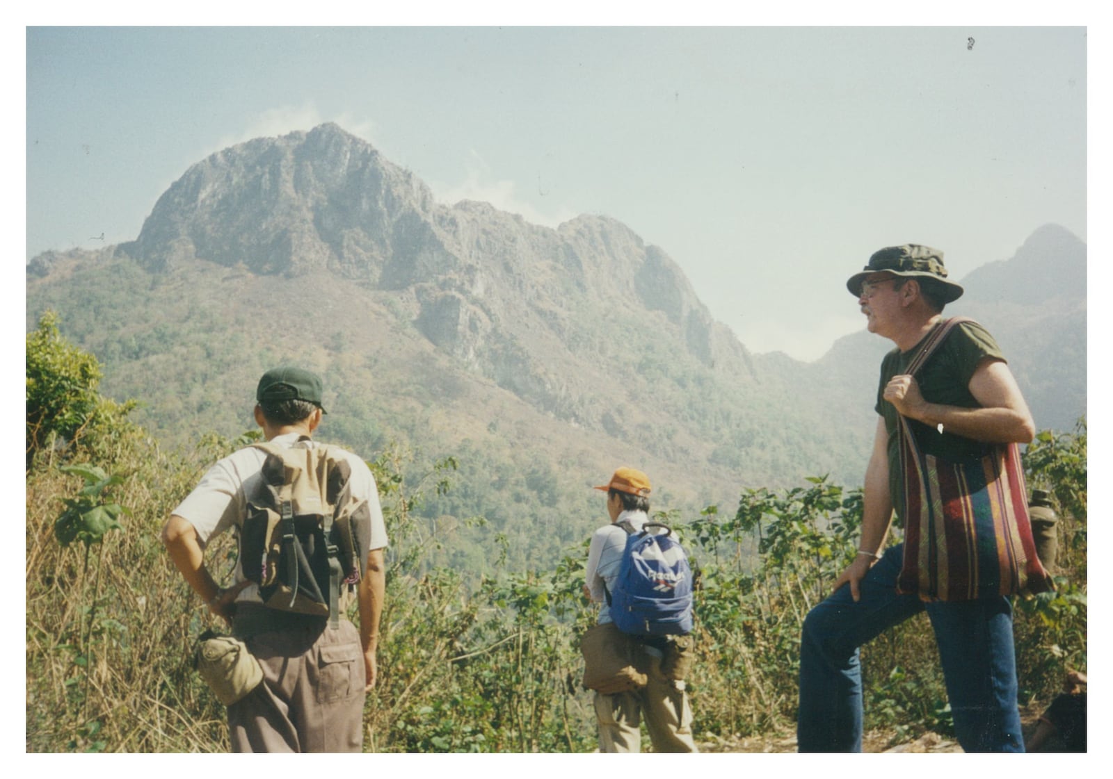 Mike Burgett, right, is shown with two colleagues in Thailand during the hike up to the summit of a mountain. CONTRIBUTED