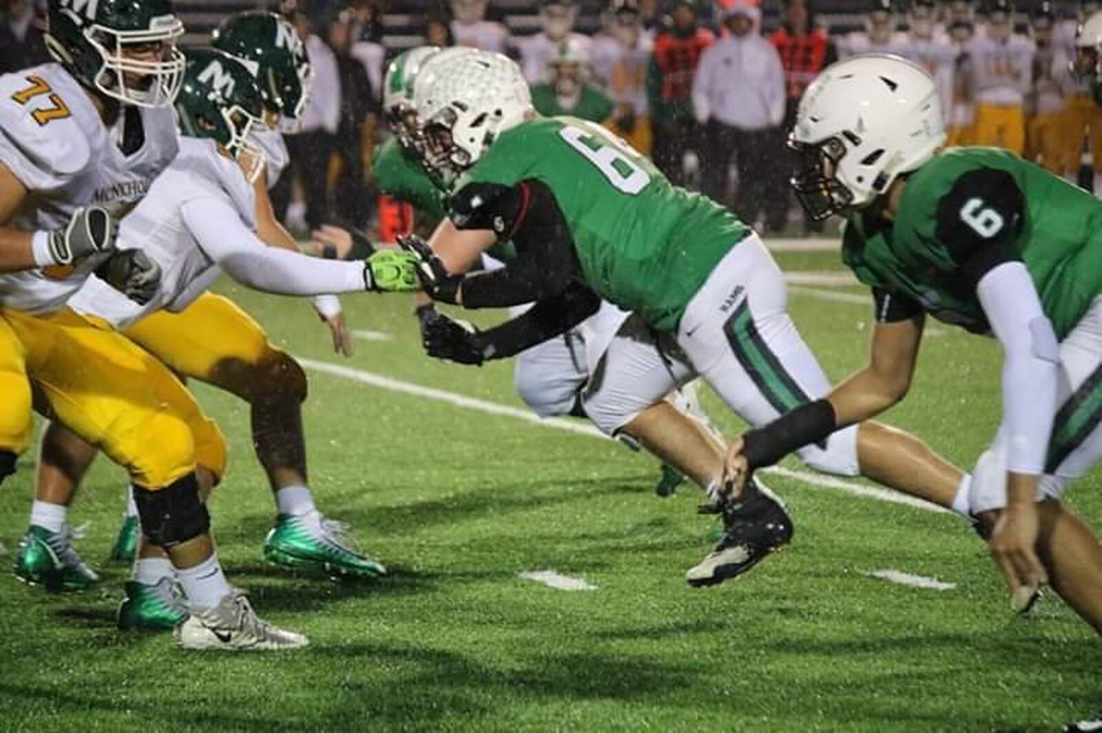 Badin’s Jayden Carter (6) and Andrew Jones (64) prepare to rush against Trey Fryman (77) of McNicholas during Friday night’s game at Virgil Schwarm Stadium in Hamilton. CONTRIBUTED PHOTO BY TERRI ADAMS