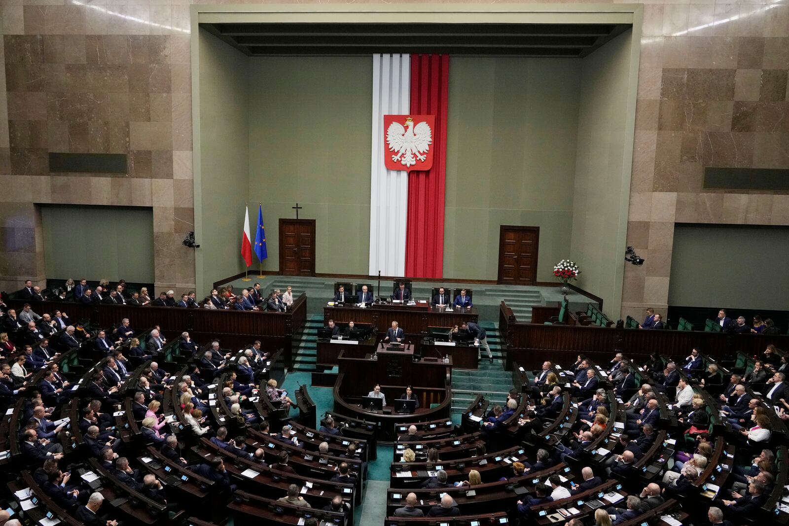 Polish Prime Minister Donald Tusk speaks to the Sejm, the lower house of parliament, on Friday March 7, 2025, in Warsaw, Poland. (AP Photo/Czarek Sokolowski)