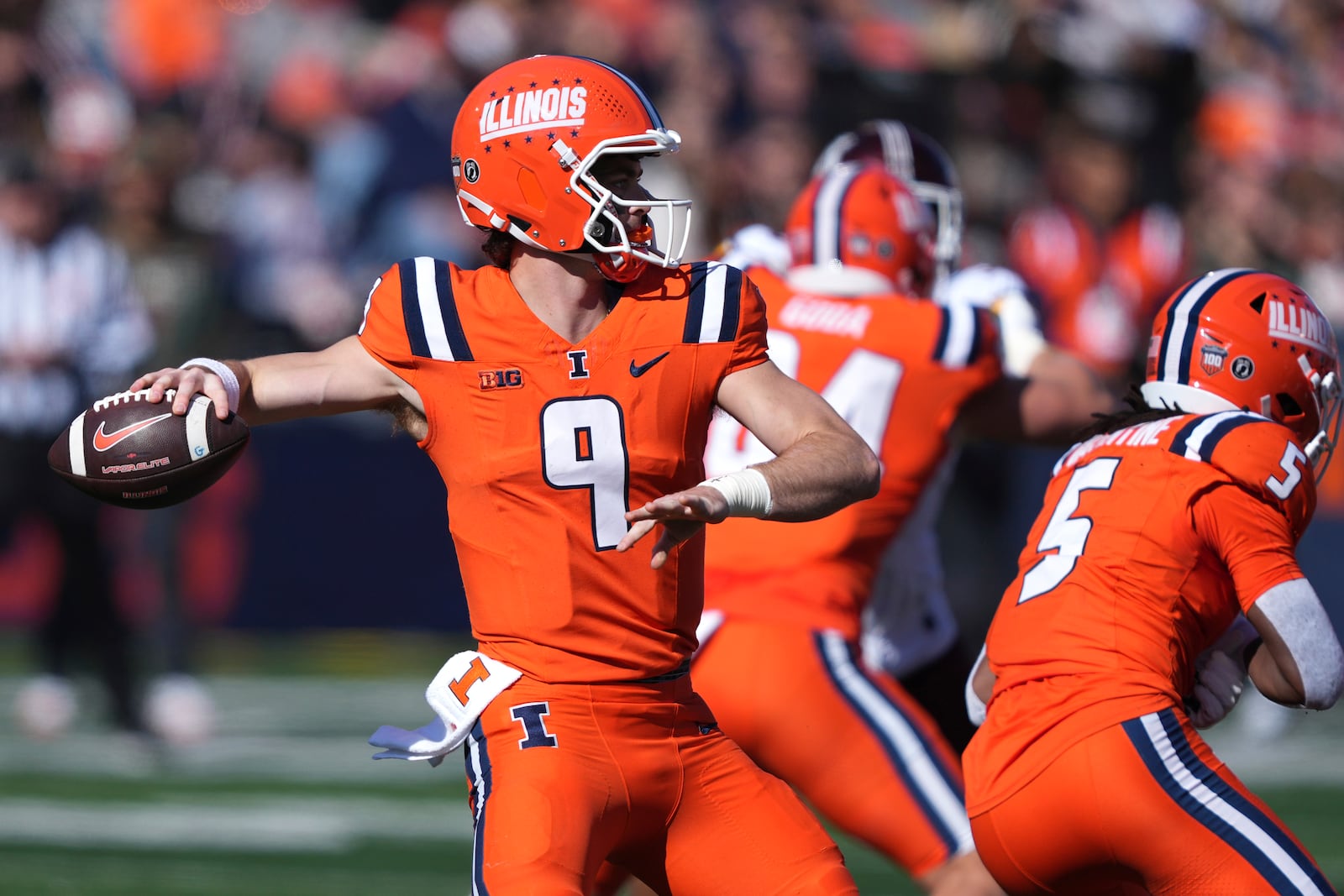 Illinois quarterback Luke Altmyer passes during the first half of an NCAA college football game against Minnesota on Saturday, Nov. 2, 2024, in Champaign, Ill. (AP Photo/Charles Rex Arbogast)