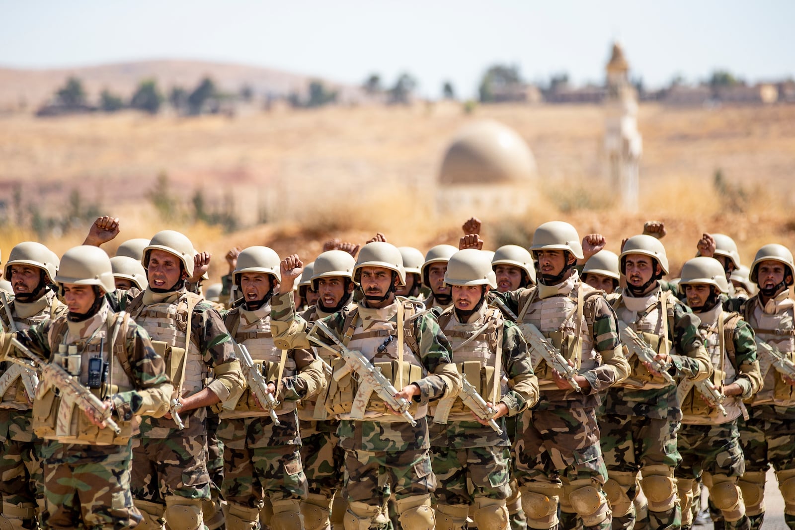 FILE - Syrian soldiers prepare to take part in military exercises led by Russian advisers at a base outside Damascus, Syria, on Sept. 24, 2019. (AP Photo/Alexander Zemlianichenko, File)