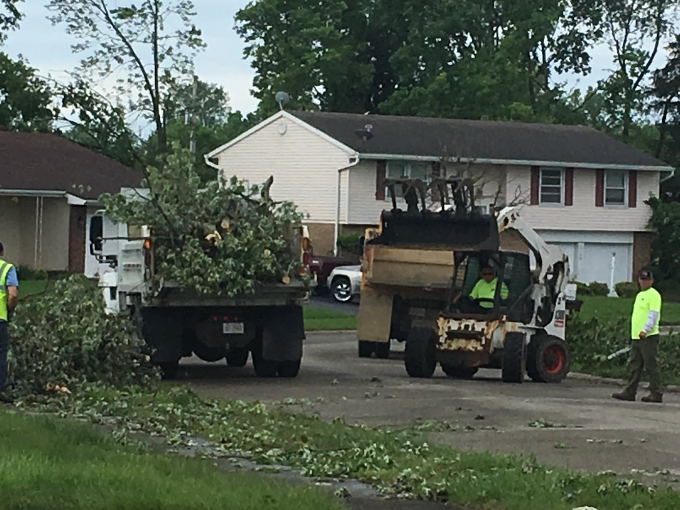 PHOTOS: Tornado-damaged communities dig out, clean up