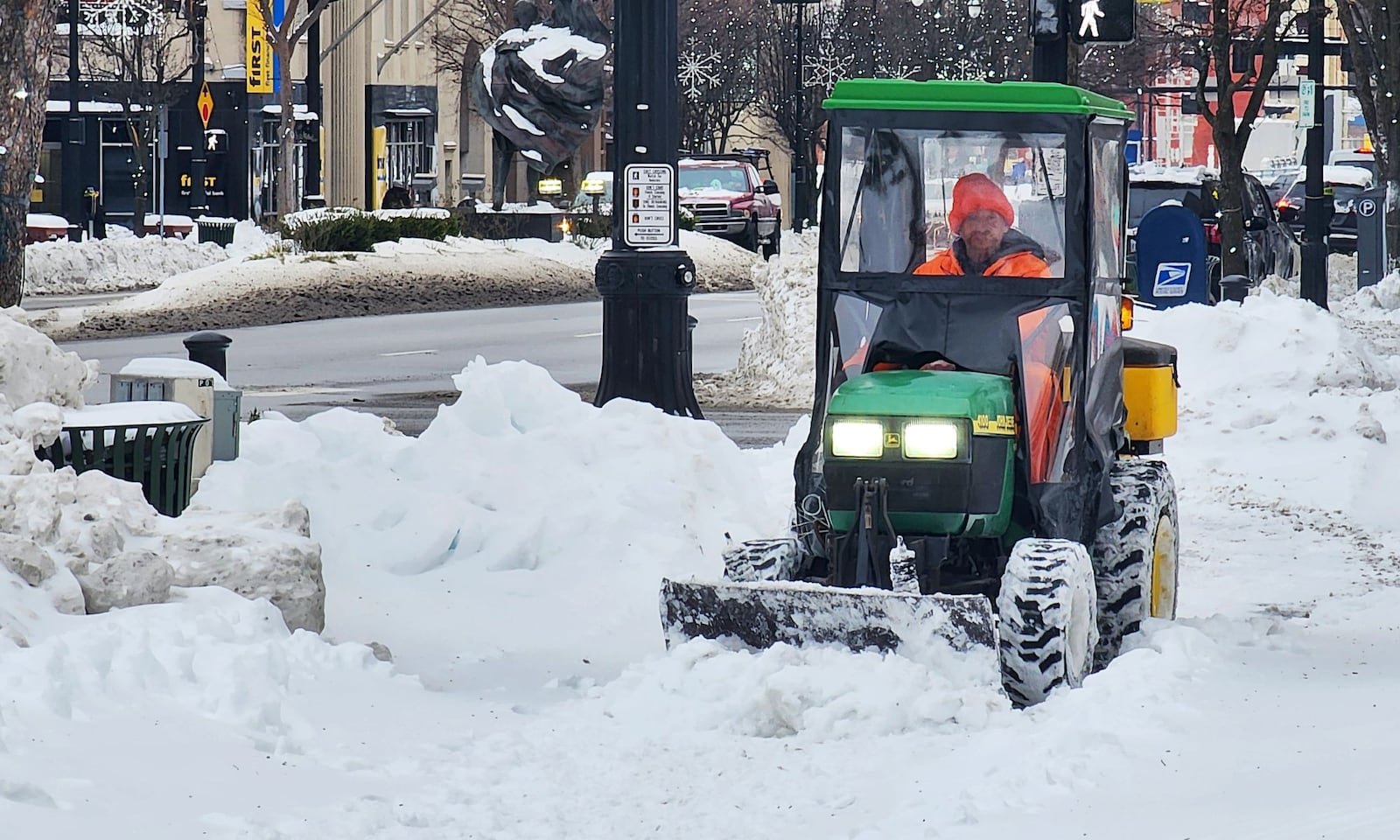 Crews are out plowing and salting sidewalks Tuesday, Jan. 7, 2025 in downtown Hamilton. NICK GRAHAM/STAFF