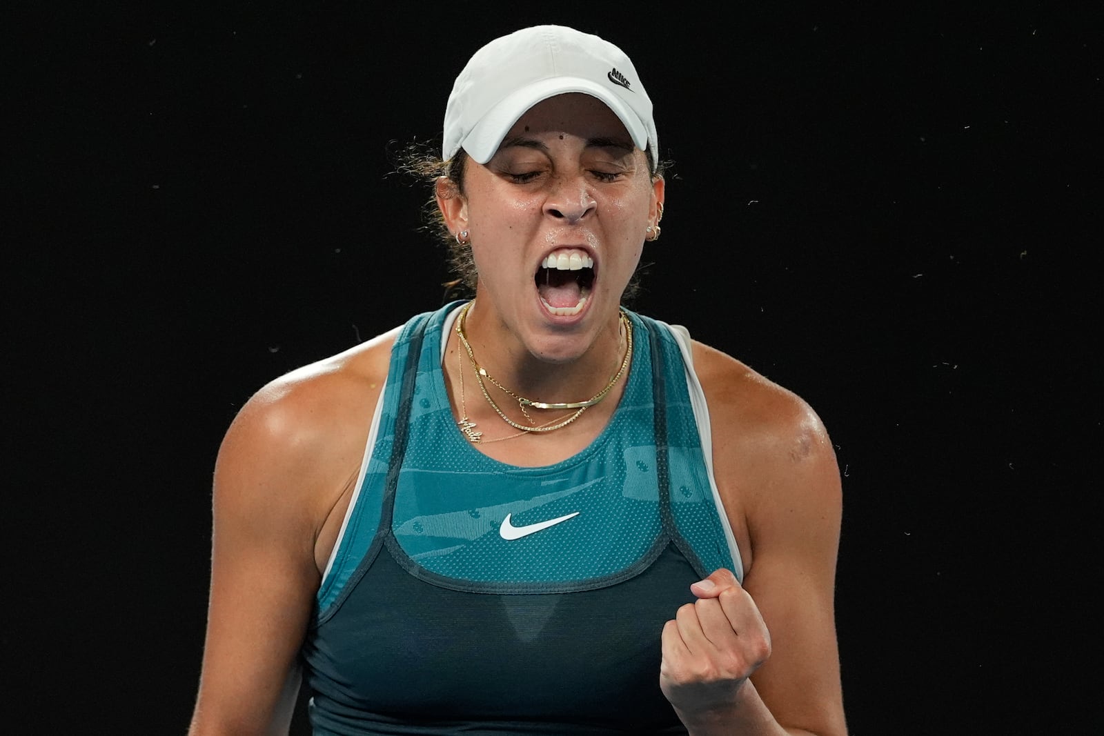 Madison Keys of the U.S. react after defeating Danielle Collins of the U.S. in their third round match at the Australian Open tennis championship in Melbourne, Australia, Saturday, Jan. 18, 2025. (AP Photo/Asanka Brendon Ratnayake)