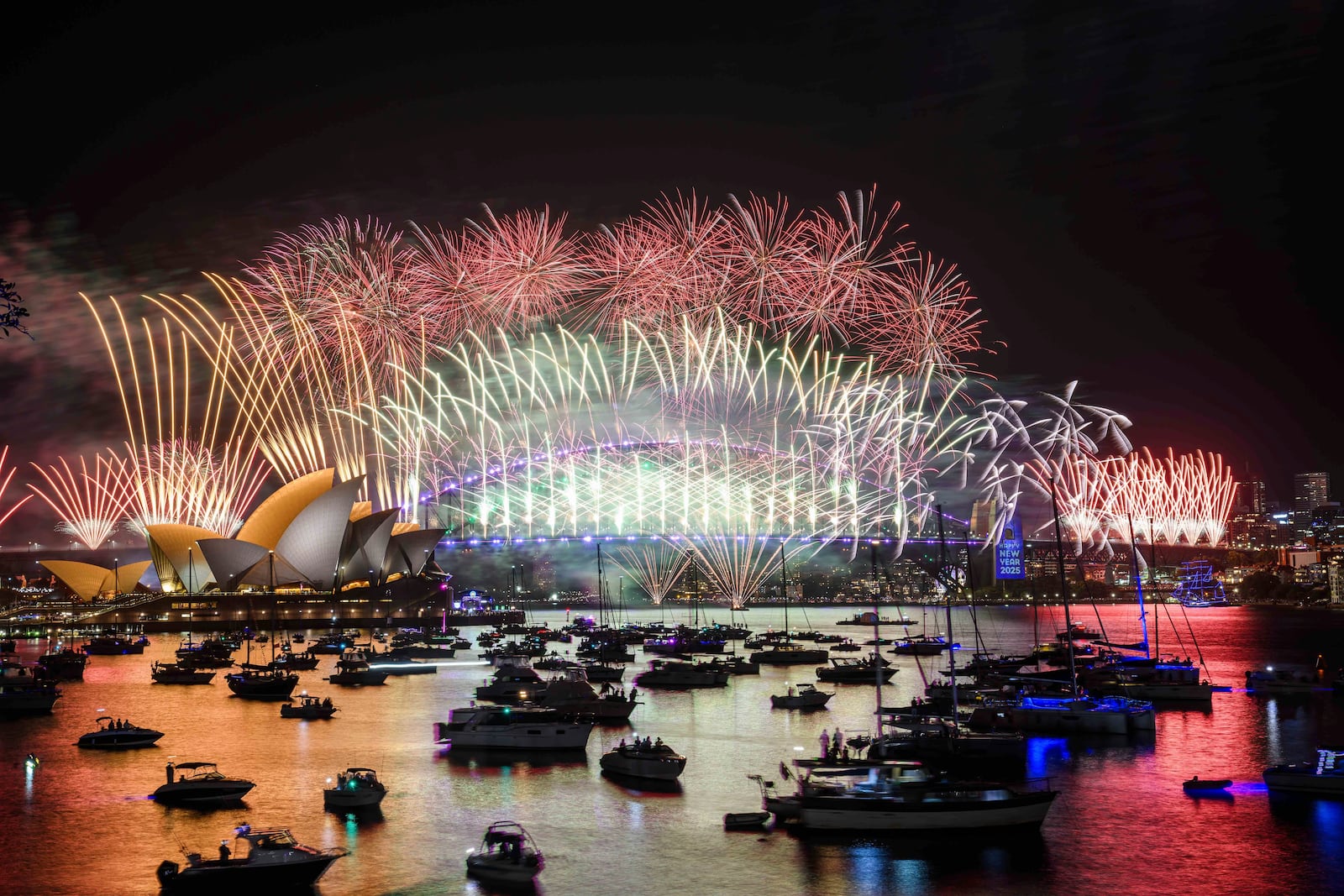 Fireworks explode over the Sydney Opera House and Harbour Bridge during New Year's Eve celebrations in Sydney, Tuesday, Dec. 31, 2024. (Bianca De Marchi/AAP Image via AP)