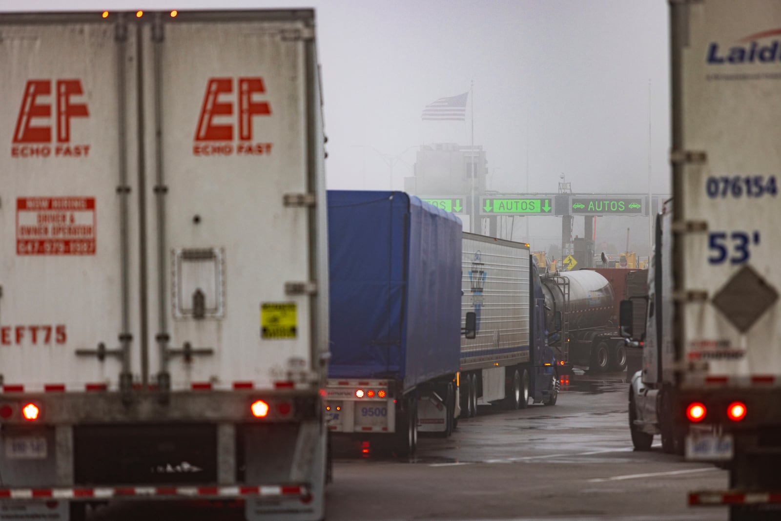 Trucks wait to cross the United States border on the Peace Bridge, Thursday, Feb. 27, 2025. (AP Photo/Lauren Petracca)