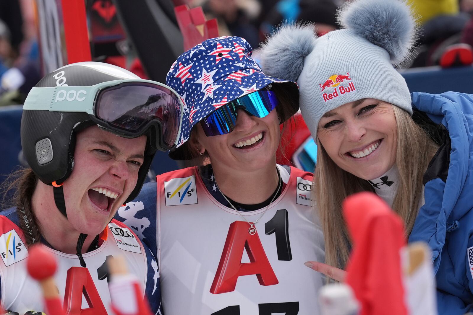 From left, second placed Austria's Stephanie Venier, the winner United States' Lauren Macuga and fourth placed Lindsey Von pose after completing an alpine ski, women's World Cup super G race, in St. Anton, Austria, Sunday, Jan. 12, 2025. (AP Photo/Giovanni Auletta)