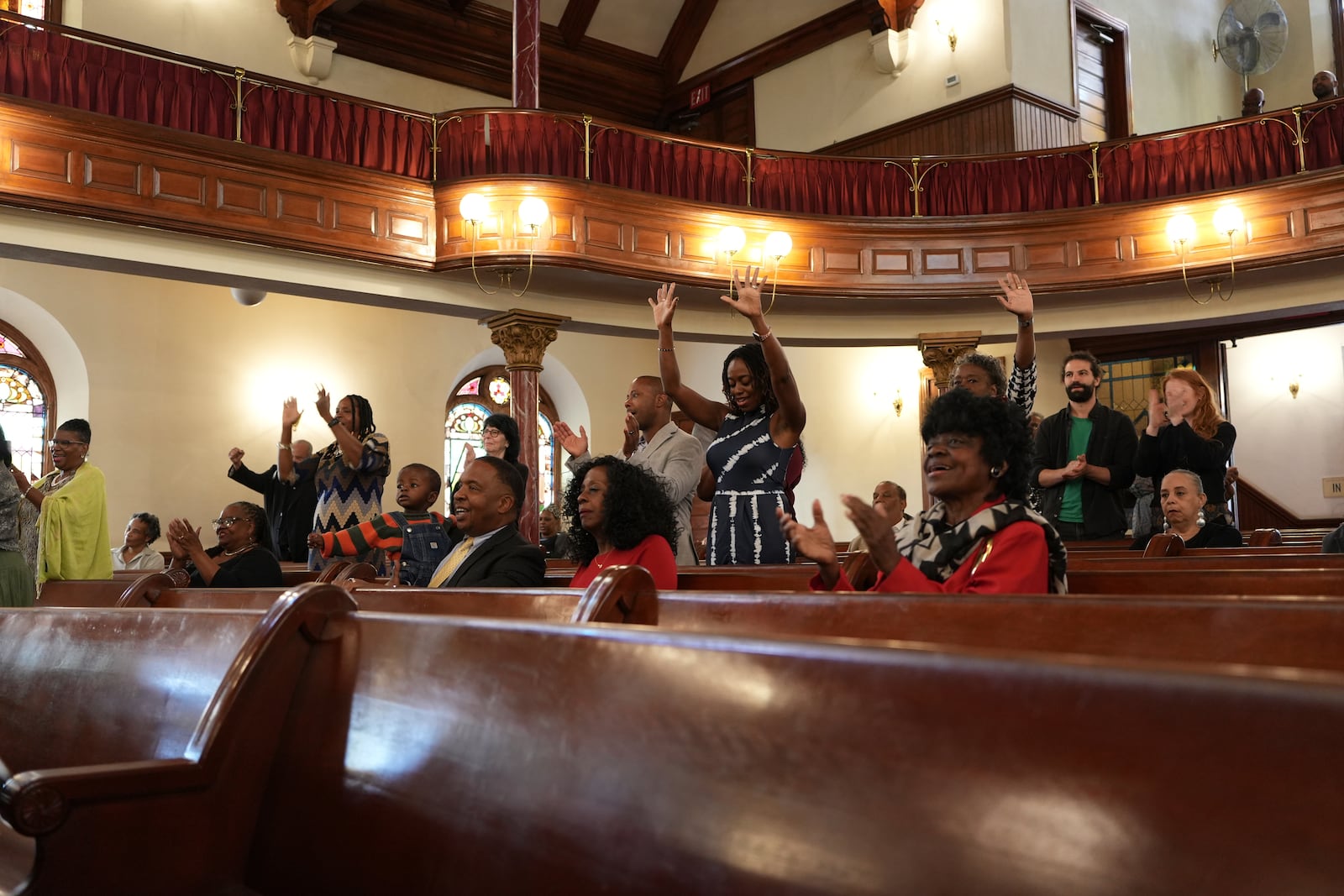 Mother Bethel AME Church congregants react to the sermon by senior pastor, the Rev. Mark Tyler, in Philadelphia, on Sunday, Sept. 29, 2024. (AP Photo/Luis Andres Henao)