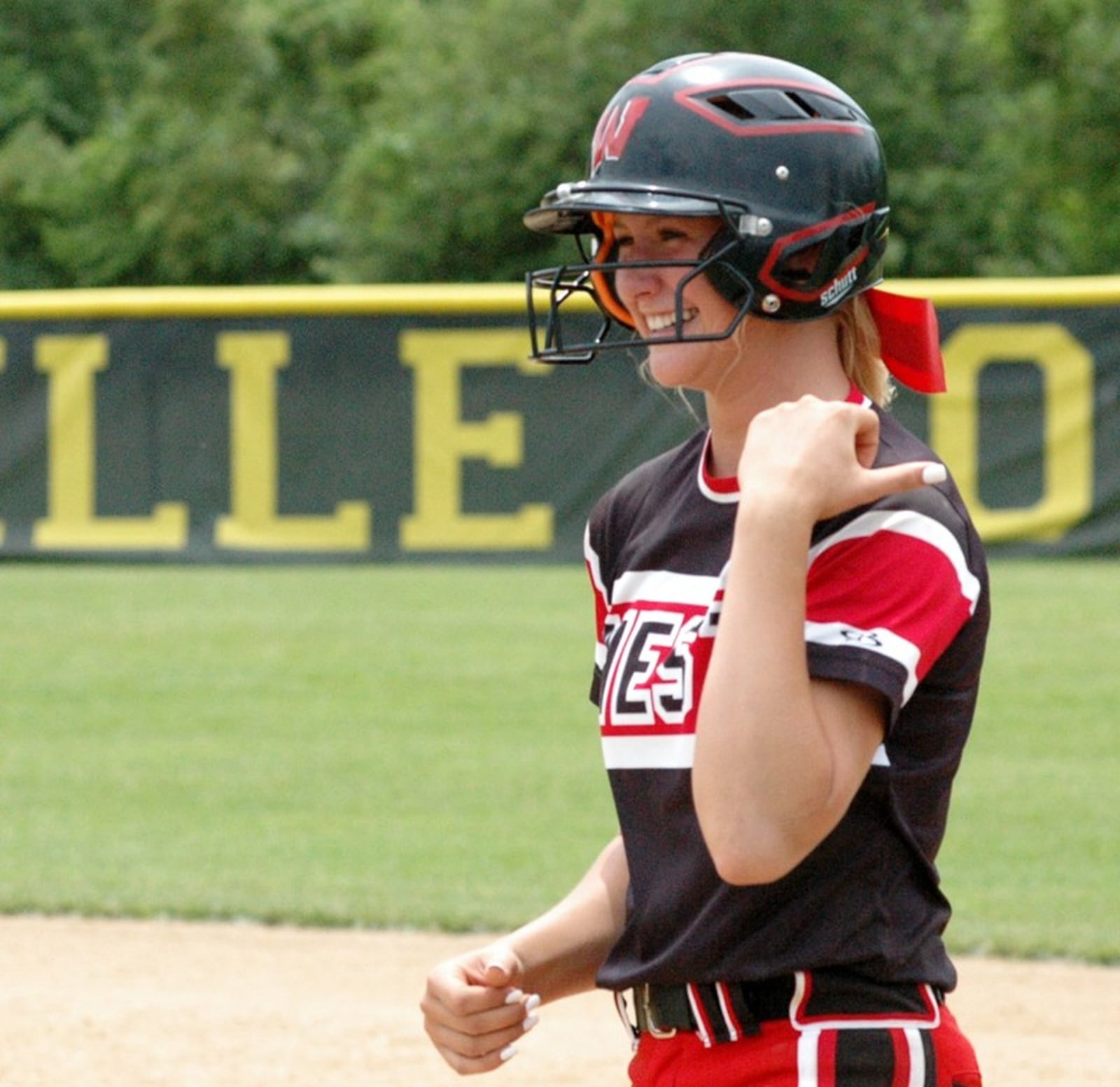 Lakota West’s Alyssa Triner smiles after making it to first base May 25 during a Division I regional championship softball game against Lakota East at Centerville. East won 2-1. RICK CASSANO/STAFF