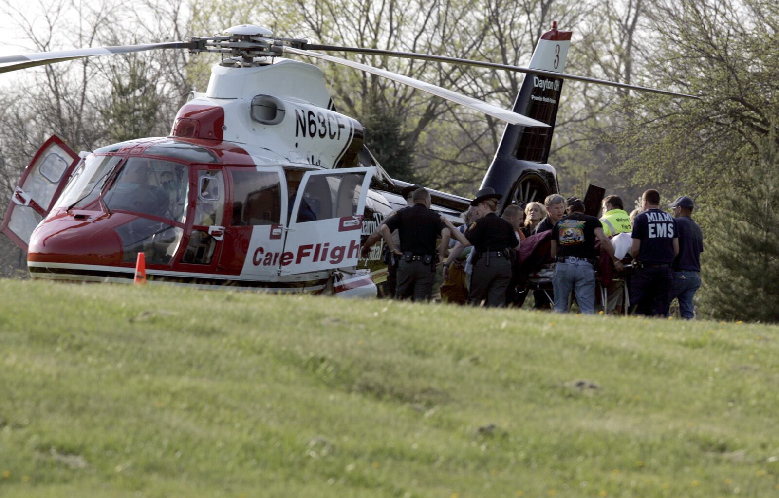 Butler County Sheriff’s Deputy Brandon Roberts is loaded into a helicopter near Seven Mile, Ohio, after suffering a gunshot wound in a confrontation with two men following a robbery. STAFF PHOTO