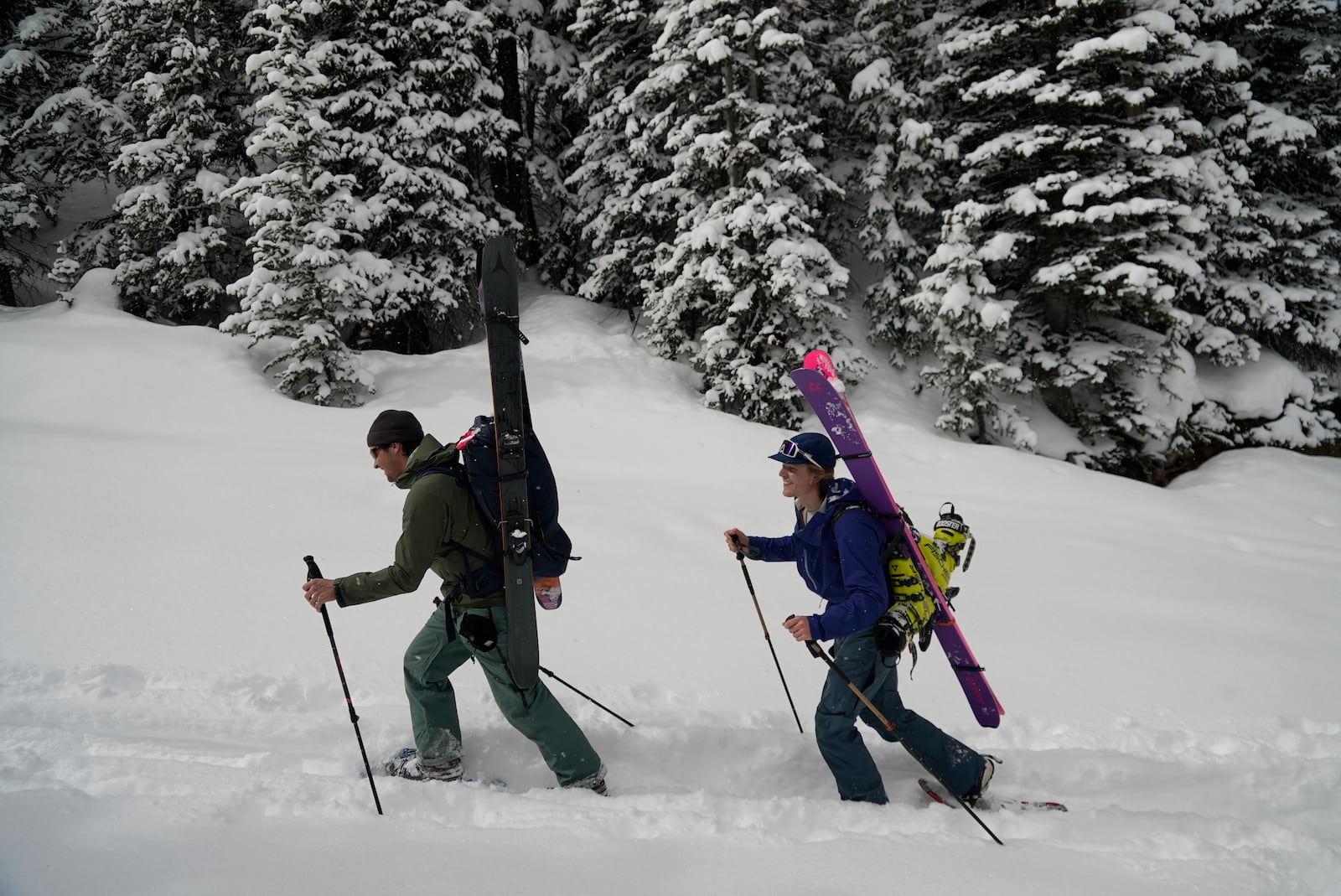 Joseph Burgoyne and Michael Otenbaker snowshoe into a backcountry ski area Wednesday, March 5, 2025, in Frisco, Colo. (AP Photo/Brittany Peterson)