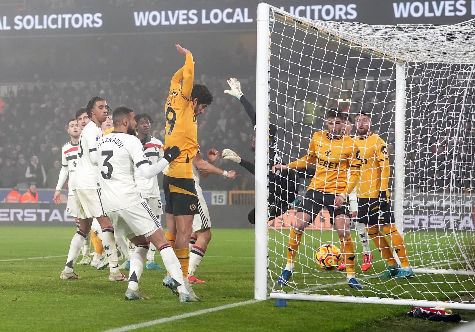 Wolverhampton Wanderers' Matheus Cunha, not in the picture, scores the opening goal during the English Premier League soccer match between Wolverhampton Wanderers and Manchester United at the Molineux Stadium, Wolverhampton, England, Thursday, Dec. 26, 2024. (David Davies/PA via AP)