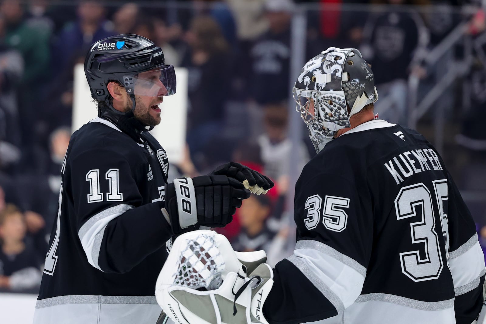 Los Angeles Kings center Anze Kopitar, left, celebrates with goaltender Darcy Kuemper after the team's win against the New Jersey Devils during an NHL hockey game, Wednesday, Jan. 1, 2025, in Los Angeles. (AP Photo/Ryan Sun)