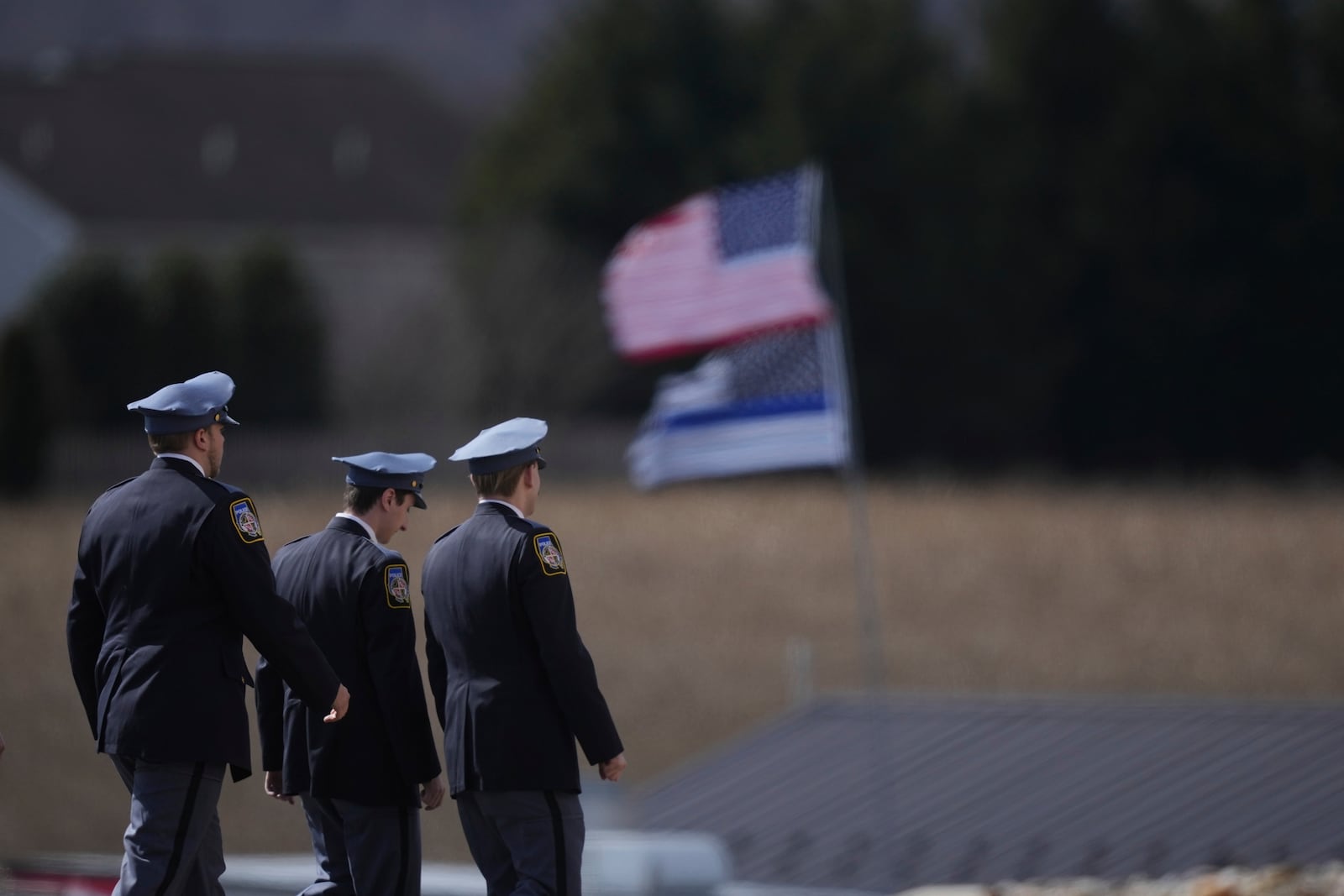 Officers arrive for the funeral of West York Borough Police Officer Andrew Duarte at Living Word Community Church, in Red Lion, Pa., Friday, Feb. 28, 2025. (AP Photo/Matt Rourke)