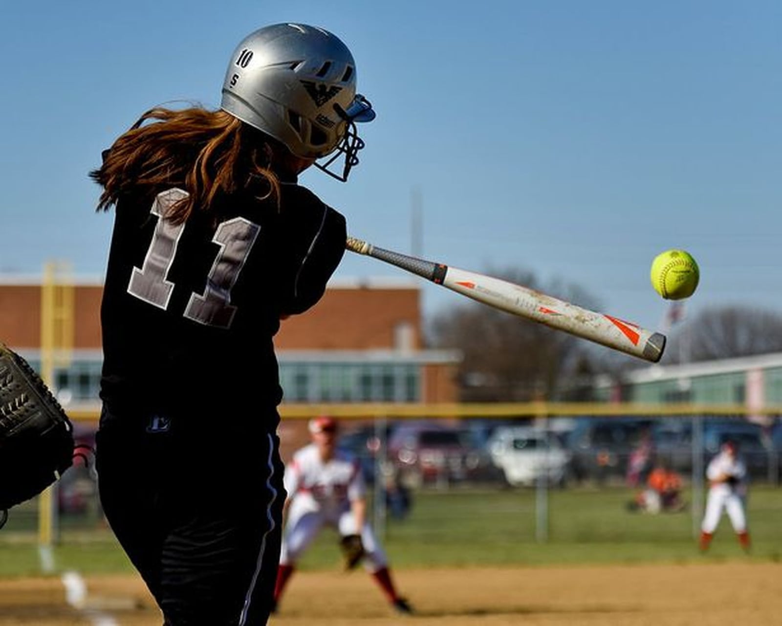 Lakota East shortstop Rachel Lewis makes solid contact with the ball on April 1, 2015, during the Thunderhawks’ 9-0 win at Fairfield. NICK GRAHAM/STAFF