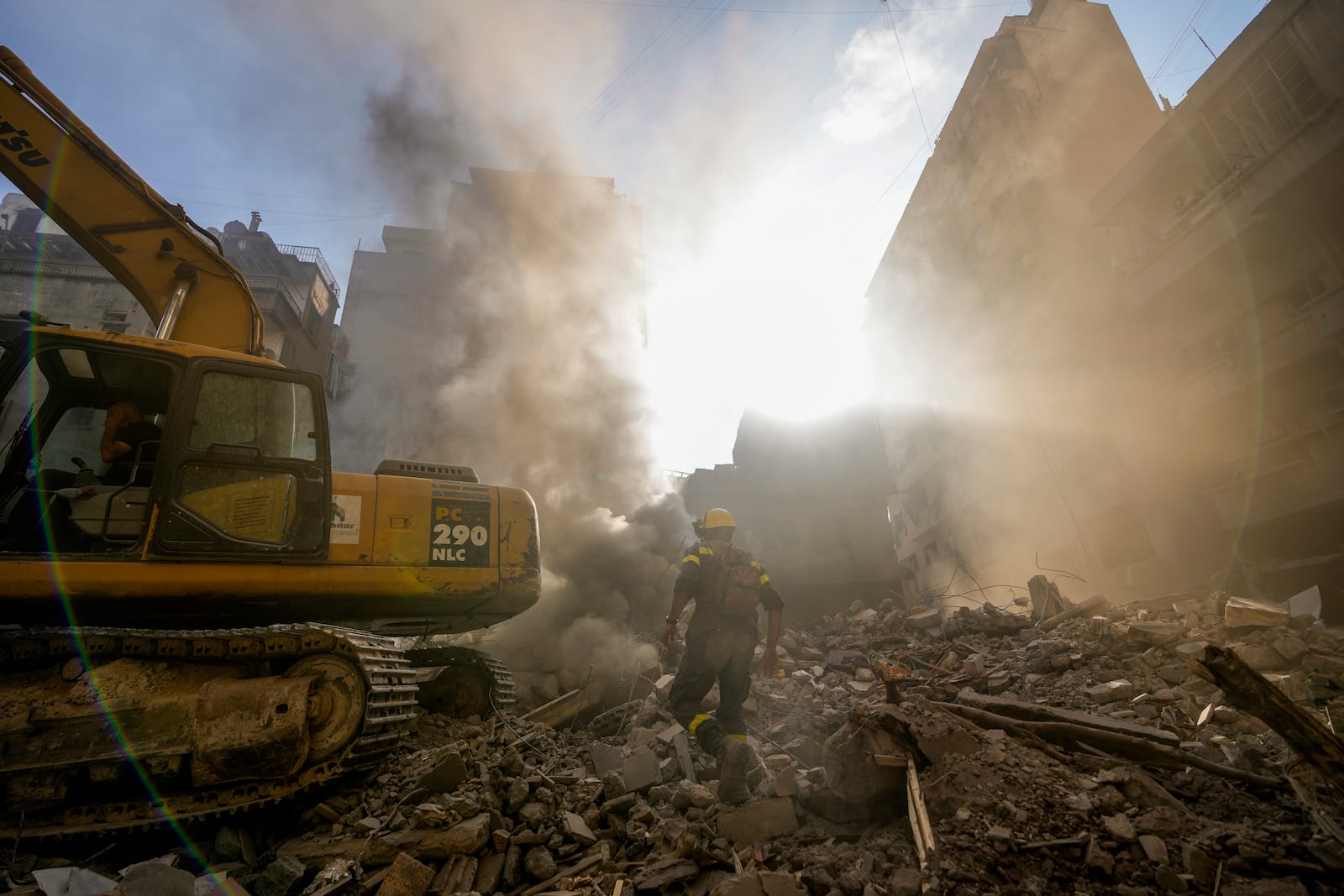 FILE - Rescue workers search for victims at the site of Thursday's Israeli airstrike in Beirut, Lebanon, Friday, Oct. 11, 2024. (AP Photo/Hassan Ammar, File)