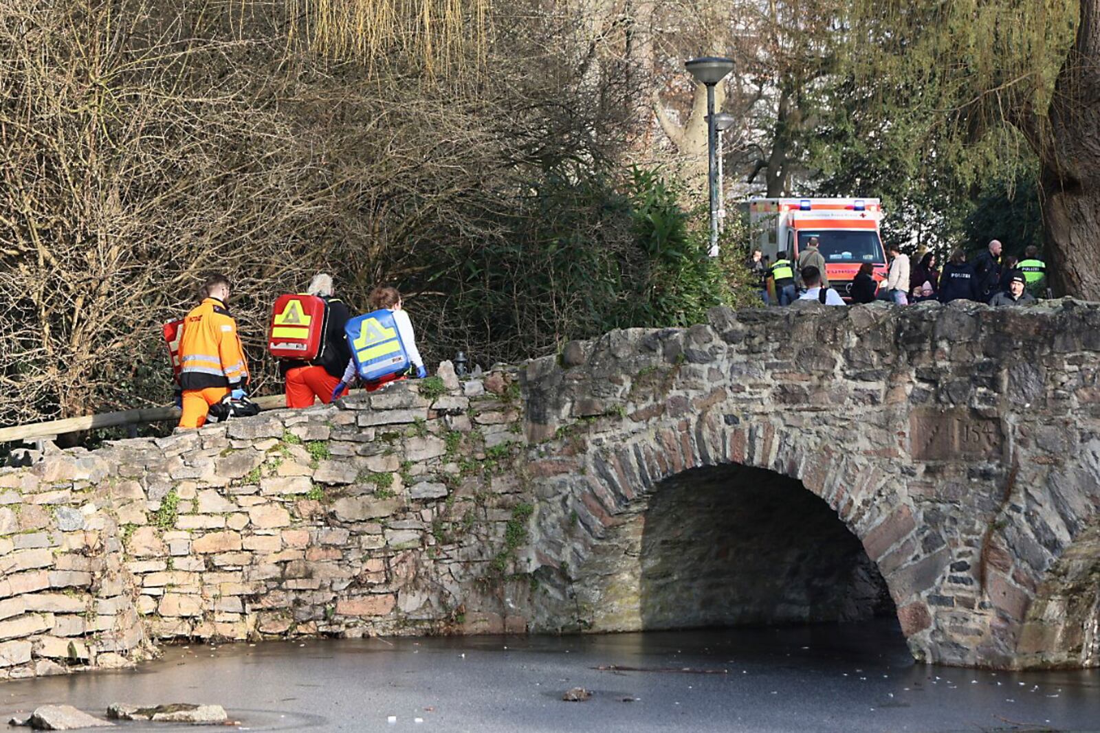 Rescue and security worker are seen near a crime scene in Aschaffenburg, Germany, Wednesday, Jan 22, 2025, where two people were killed in a knife attack. (Ralf Hettler/dpa via AP)