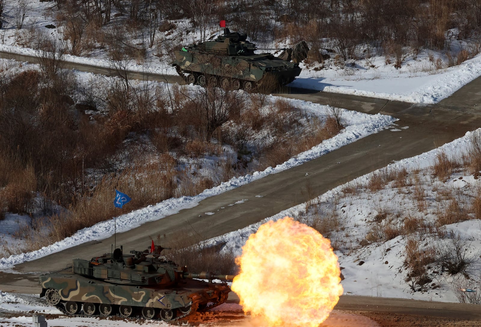 A South Korea army's K1A2 tank fires during the joint military drill between South Korea and the United States at Seungjin Fire Training Field in Pocheon, South Korea, Thursday, March 6, 2025. (Yonhap via AP)