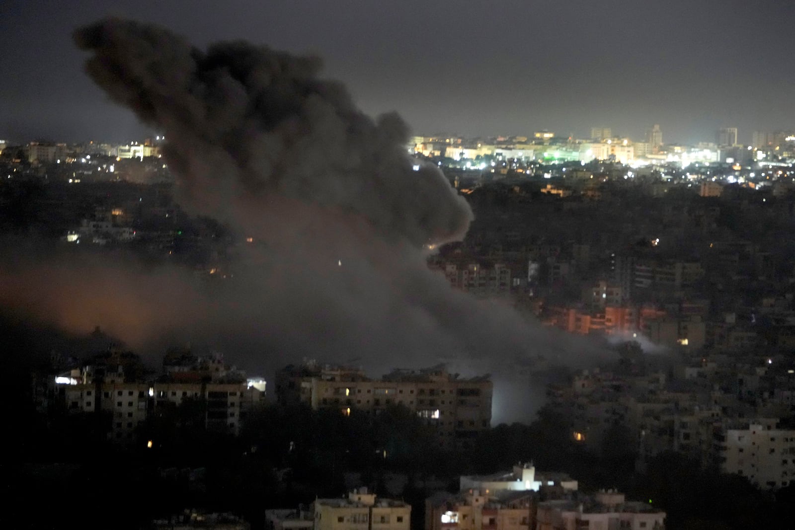 Smoke rises from an Israeli airstrike on Dahiyeh, in the southern suburb of Beirut, Lebanon, early Sunday, Oct. 27, 2024. (AP Photo/Hussein Malla)