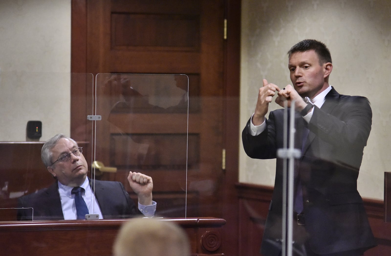 Assistant prosecutor Jon Marshall, right, questions pathologist Dr. Lee Lehman about puncture wounds during the trial of Peyton McFarland for the death of Chris Hacker Tuesday, April 20, 2021 in Butler County Common Pleas Court in Hamilton. The defense says McFarland acted in self defense when he stabbed Chris Hacker to death at their Monroe residence. NICK GRAHAM / STAFF