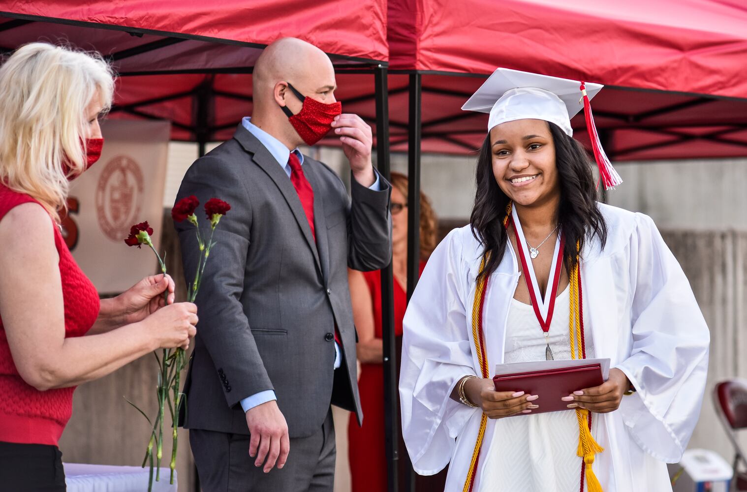 Madison High School drive-thru graduation ceremony at Land of Illusion