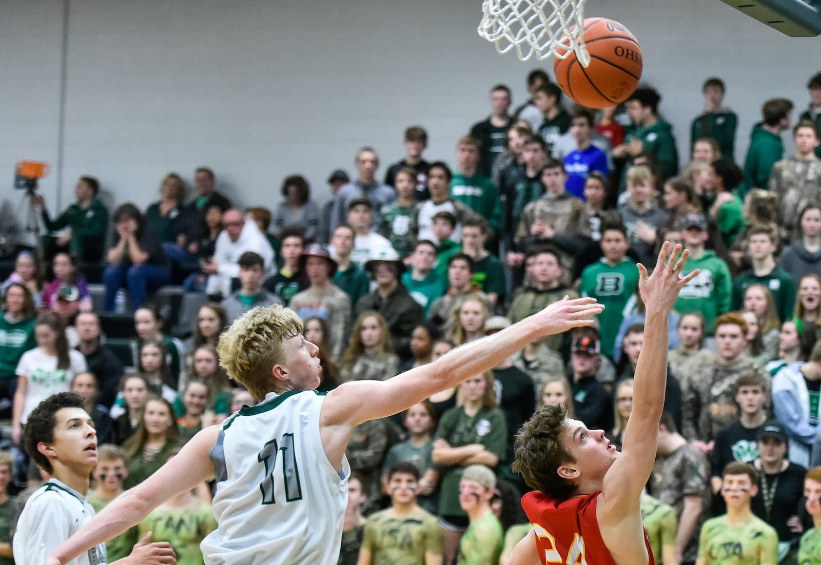 Badin’s Kyle Young goes after a shot by Fenwick’s David Luers on Jan. 19 at Mulcahey Gym in Hamilton. Fenwick was victorious 61-56 in overtime. NICK GRAHAM/STAFF