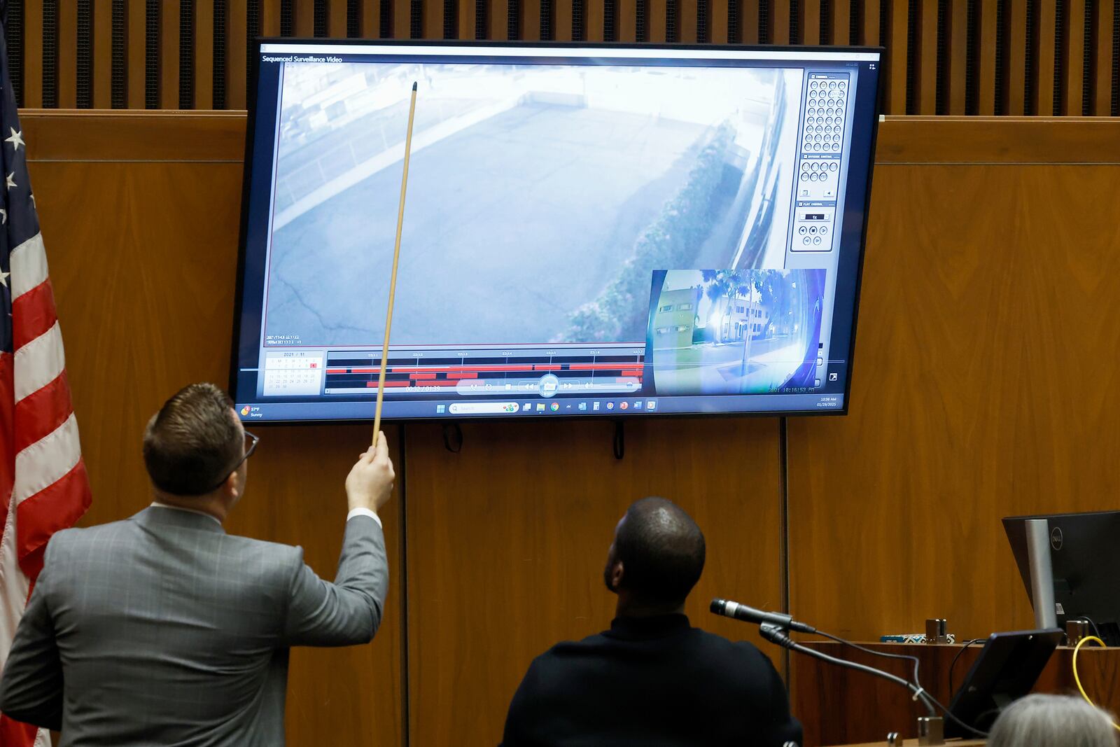 Los Angeles County Deputy District Attorney Paul Przelomiec, left, reviews an image displayed on a screen as he stands next to A$AP Relli during A$AP Rocky's trial at the Clara Shortridge Foltz Criminal Justice Center in Los Angeles, Wednesday, Jan. 29, 2025. (Frazer Harrison/Pool Photo via AP)