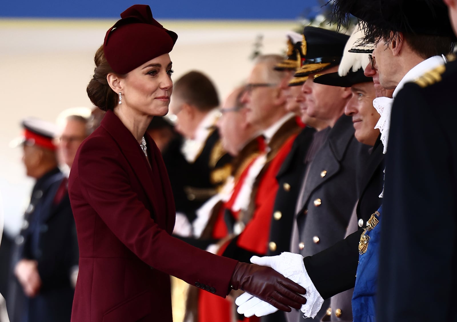 Britain's Catherine, Princess of Wales, greets dignitaries as she arrives ahead of a Ceremonial Welcome for the Emir of Qatar Sheikh Tamim bin Hamad Al Thani and his wife Sheikha Jawaher, at Horse Guards Parade in London, Tuesday Dec. 3, 2024. (Henry Nicholls via AP, Pool)