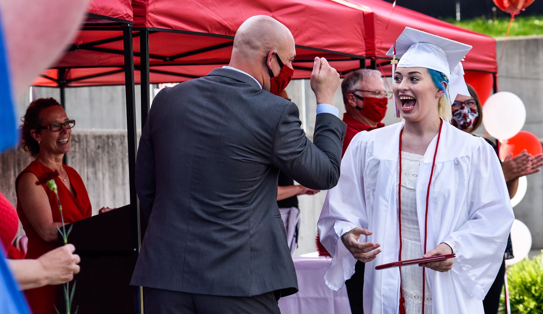 Madison High School drive-thru graduation ceremony at Land of Illusion