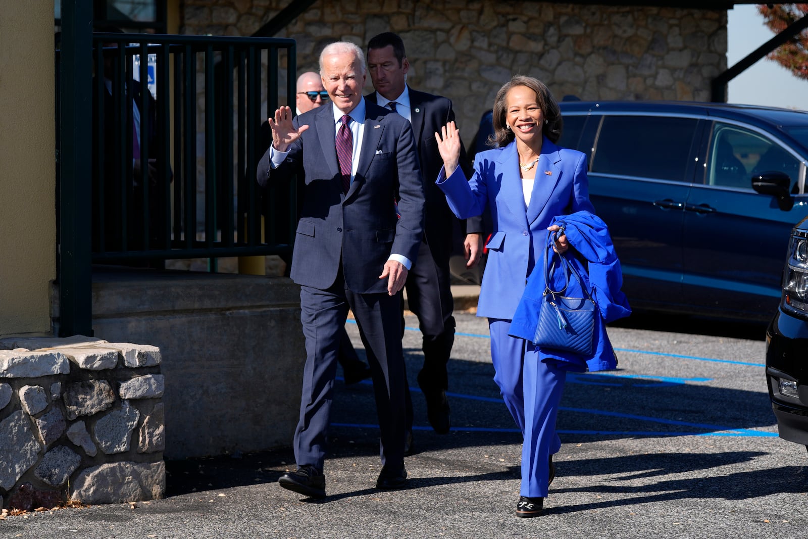 President Joe Biden, left, walks with Rep. Lisa Blunt Rochester, D-Del., after having breakfast at The Legend Restaurant & Bakery, Monday, Oct. 28, 2024, in New Castle, Del. (AP Photo/Manuel Balce Ceneta)