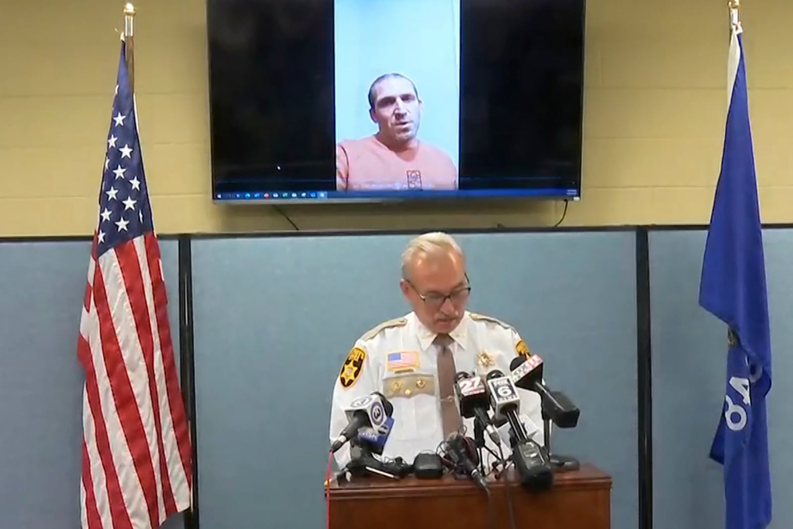 This still image provided by Green Lake County Sheriff's Office, Sheriff Mark Podoll holds a news conference regarding Ryan Borgwardt, who faked his own drowning this summer on Thursday, Nov. 21, 2024 in Green Lake, Wis. (Green Lake County Sheriff's Office via AP)