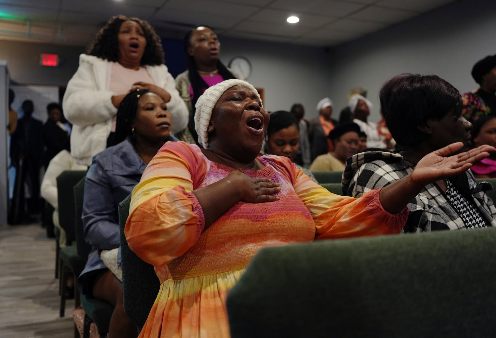 Congregants worship together at the First Haitian Evangelical Church of Springfield, Sunday, January 26, 2025, in Springfield, Ohio. (AP Photo/Luis Andres Henao)