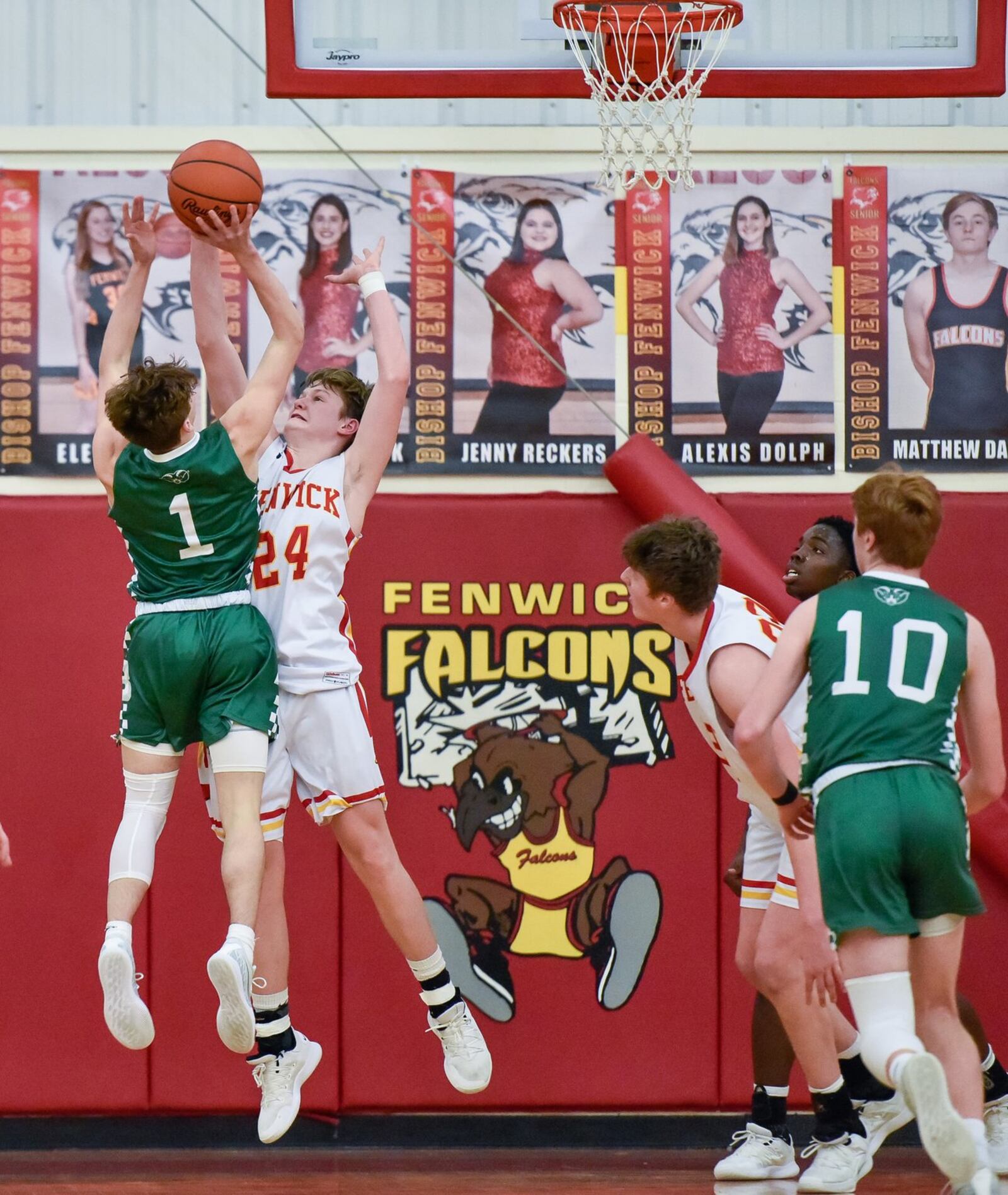 Fenwick’s Dan Luers tries to defend a shot by Badin’s Joseph Walsh during Friday night’s game in Middletown. Fenwick won 56-45. NICK GRAHAM/STAFF