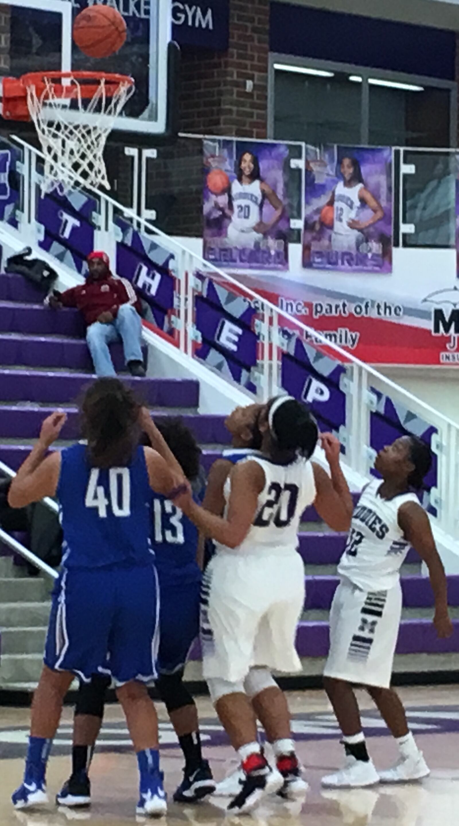 Hamilton’s Jade Wells (40) and Andrea Green (13), along with Middletown’s Aubriana Bellard (20) and Aliyah Burks (12), keep a close eye on the ball Saturday afternoon at Wade E. Miller Arena in Middletown. RICK CASSANO/STAFF