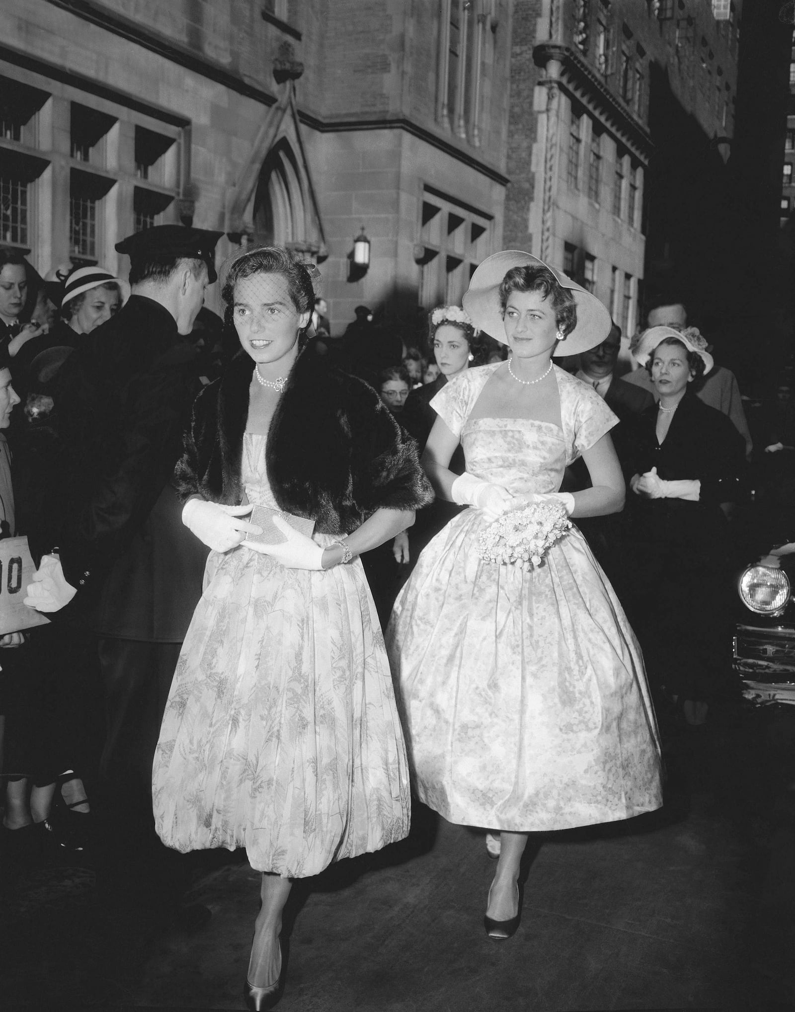 FILE - Mrs. Robert F. Kennedy, left, and Jean Kennedy, sister-in-law and sister, respectively of Patricia Kennedy, enter the Roman Catholic Church of St. Thomas More in New York, April 24, 1954, to attend Patricias wedding to actor Peter Lawford. Ethel Kennedy is at left. (AP Photo/Matty Zimmerman, File)