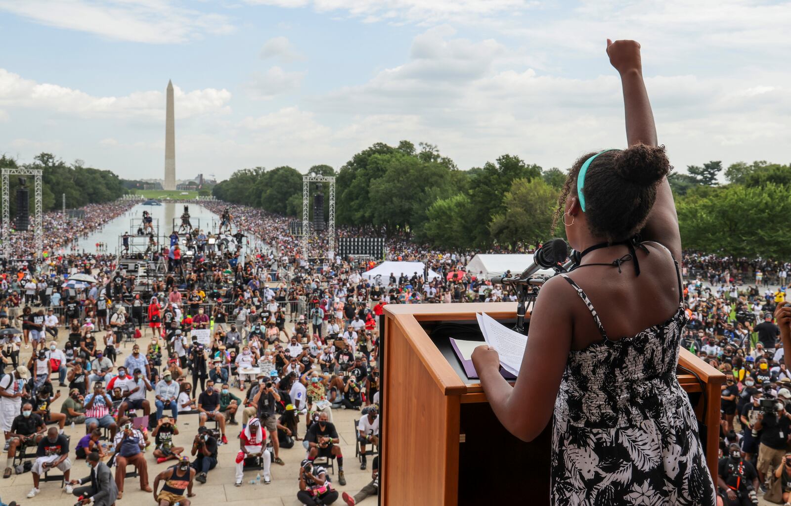 FILE - In this Friday, Aug. 28, 2020, file photo, Yolanda Renee King, granddaughter of the Rev. Martin Luther King Jr., raises her fist as she speaks during the March on Washington, on the 57th anniversary of the Rev. Martin Luther King Jr.'s "I Have A Dream" speech. California lawmakers are setting up a task force to study and make recommendations for reparations to African-Americans, particularly the descendants of slaves, as the nation struggles again with civil rights and unrest following the latest shooting of a Black man by police. The state Senate supported creating the nine-member commission on a bipartisan 33-3 vote Saturday, Aug. 29, 2020. (Jonathan Ernst/Pool via AP, File)