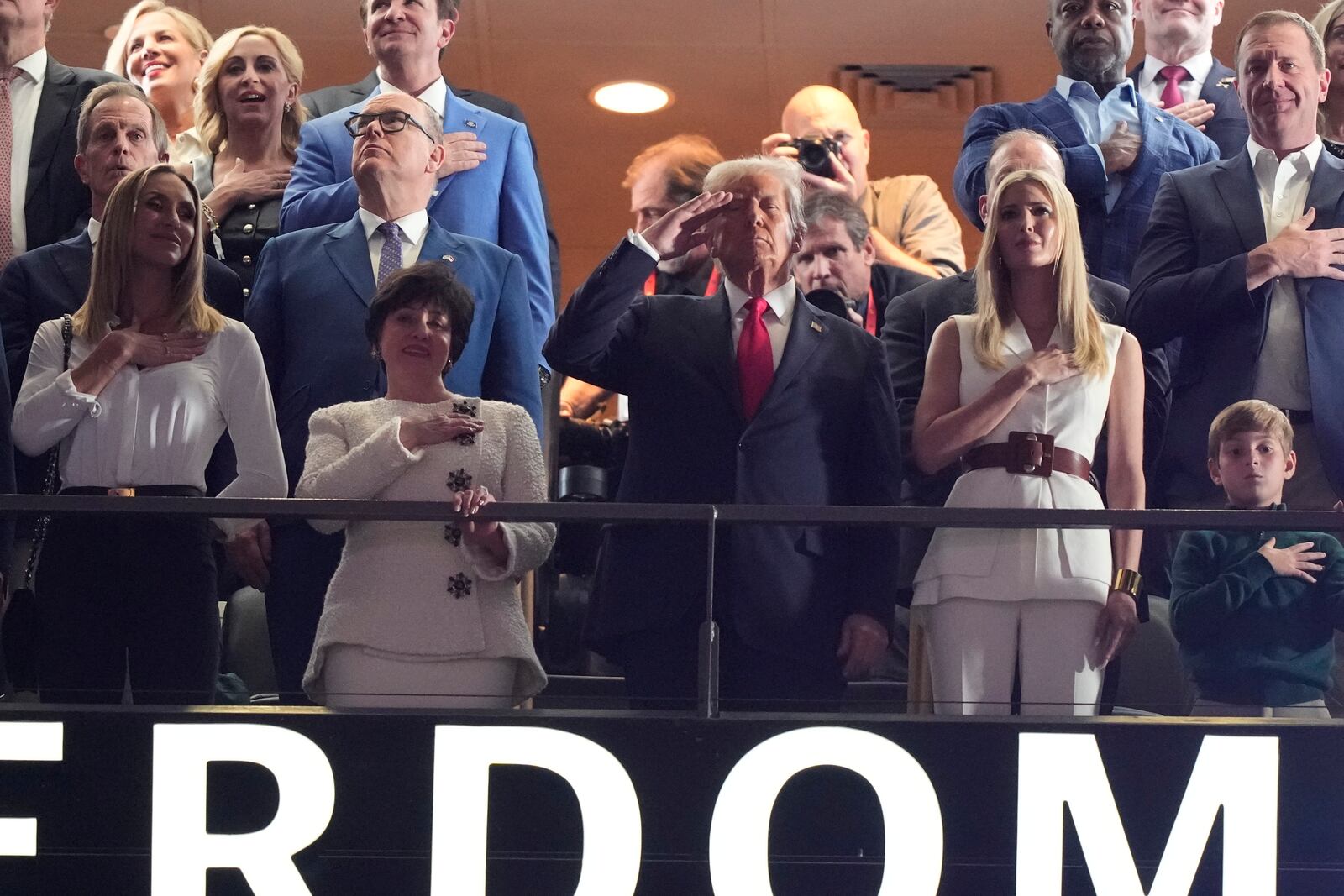 Lara Trump, from left, New Orleans Saints owner Gayle Benson, President Donald Trump, his daughter Ivanka Trump and Ivanka Trump's son Theodore watch from a suite prior to the NFL Super Bowl 59 football game between the Philadelphia Eagles and the Kansas City Chiefs, Sunday, Feb. 9, 2025, in New Orleans. (AP Photo/Brynn Anderson)