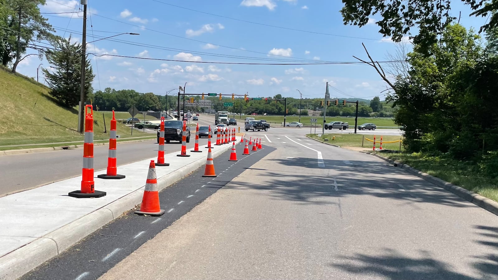 Pictured is a new concrete median on Friday, July 7, 2023, that was recently constructed on New London Road heading toward the Columbia Bridge and Ohio 128. Hamilton had new concrete medians and ADA-compliant pedestrian ramps installed in the area. The Ohio Department of Transportation is expected in 2024 to repave part of Ohio 128 in the city. Hamilton City Council recently approved a new agreement with ODOT to allow the project to take place, as a portion of the road is not within the state transportation agency's jurisdiction. MICHAEL D. PITMAN/STAFF