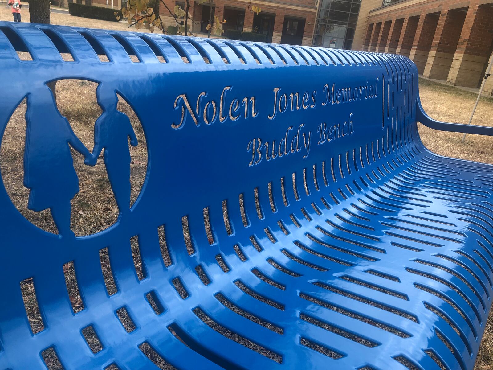 The Nolen James Memorial Buddy Bench, named in memory of a 6-year-old Hamilton boy killed May 11, 2021 was dedicated Tuesday outside Linden Elementary School in Hamilton. RICK McCRABB/STAFF