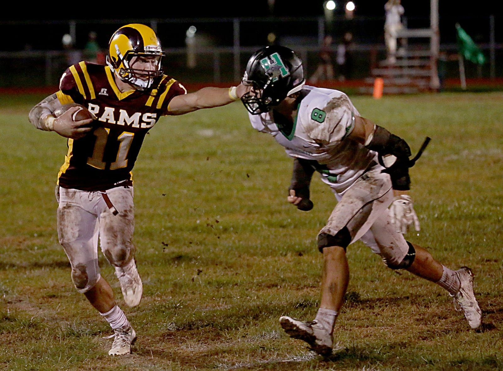 Ross quarterback Zach Arno tries to avoid Harrison defensive back Bailey Smith during their football game at Ross on Sept. 16, 2016. CONTRIBUTED PHOTO BY E.L. HUBBARD