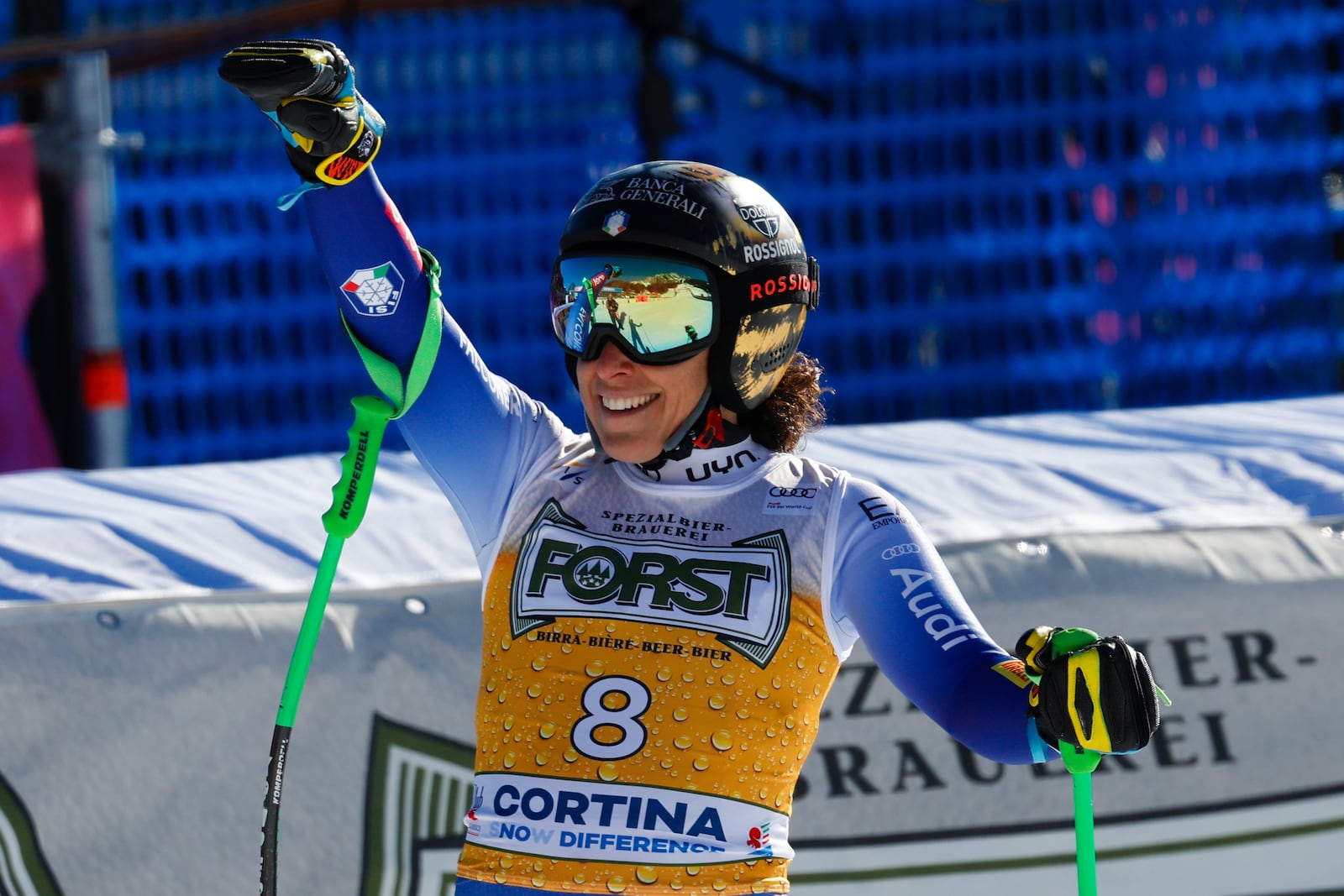 Italy's Federica Brignone celebrates at the finish area of an alpine ski, women's World Cup downhill, in Cortina d'Ampezzo, Italy, Saturday, Jan. 18, 2025 (AP Photo/Alessandro Trovati)