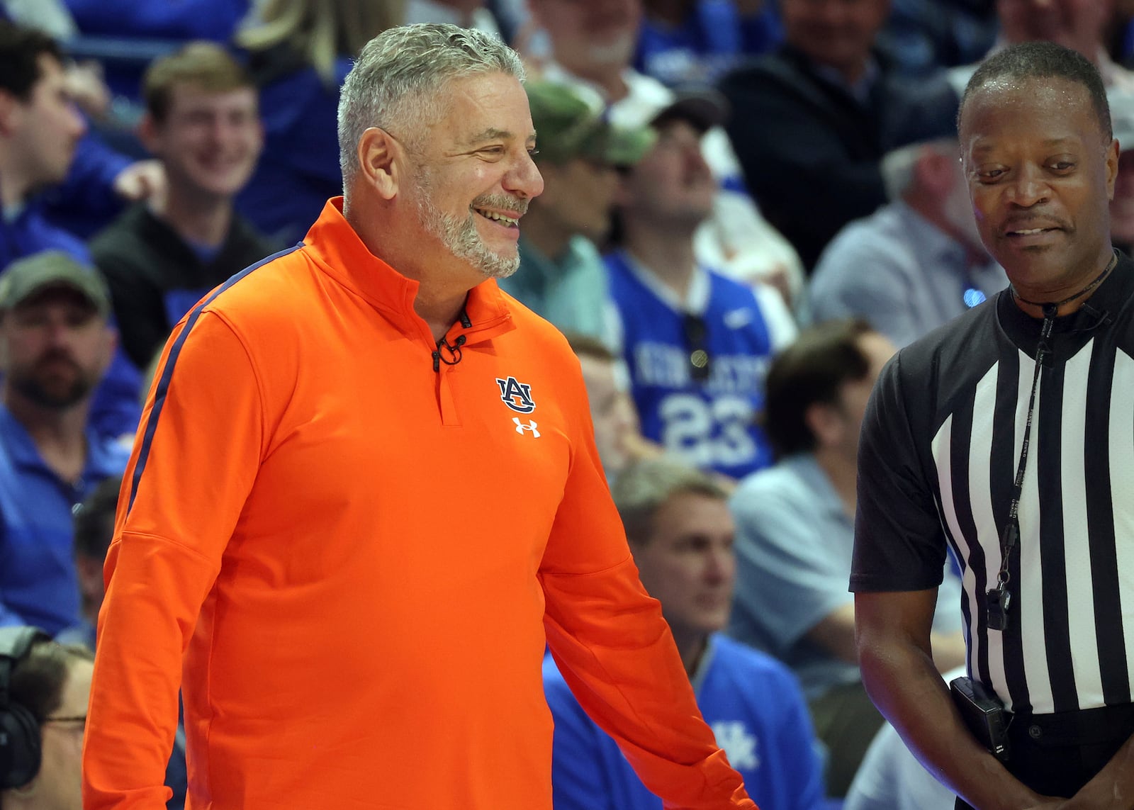 Auburn head coach Bruce Pearl, left, enjoys a lighter moment with referee Chuck Jones in the second half of an NCAA college basketball game against Kentucky in Lexington, Ky., Saturday, March 1, 2025. (AP Photo/James Crisp)