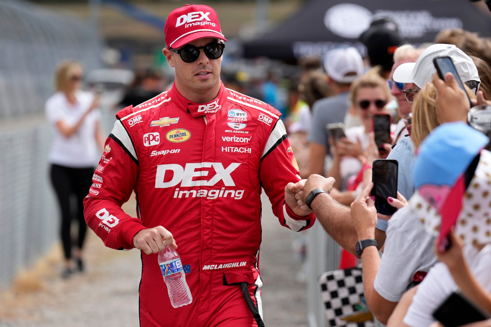 FILE - Scott McLaughlin greets fans before an IndyCar auto race, Sept. 15, 2024, at the Nashville Superspeedway in Lebanon, Tenn. (AP Photo/Mark Humphrey, File)