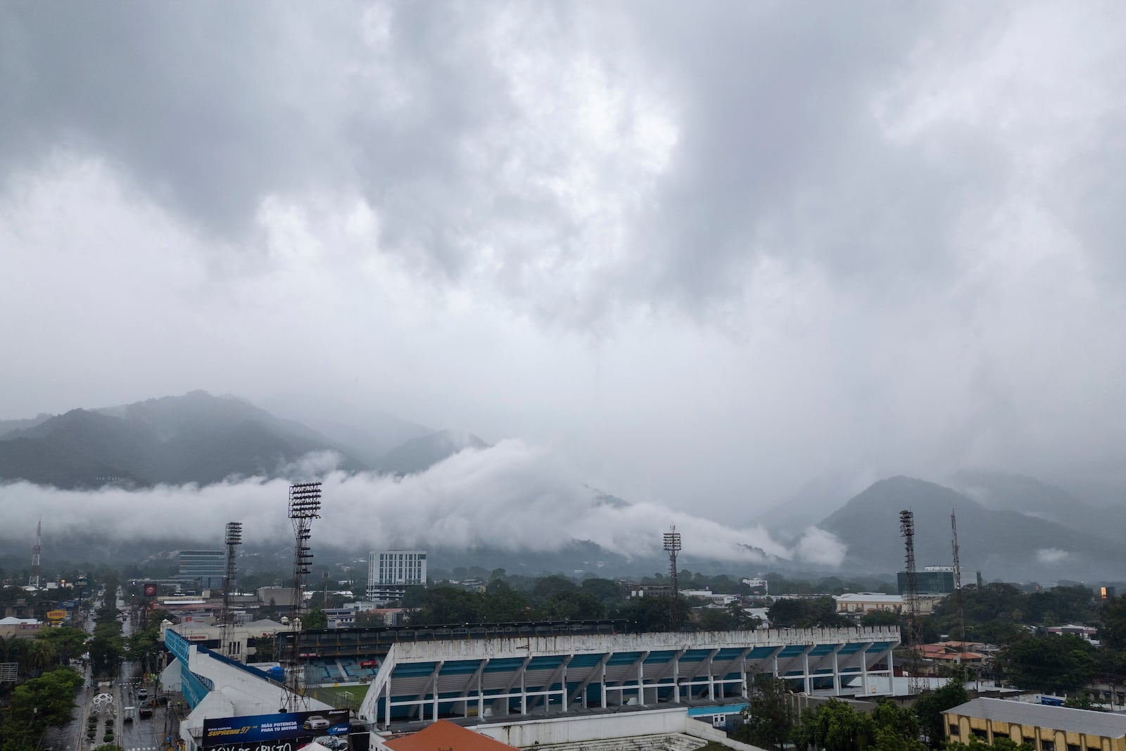 Storm clouds descend over the Francisco Morazan stadium during rains brought on by Tropical Storm Sara in San Pedro Sula, Honduras, Friday, Nov. 15, 2024. (AP Photo/Moises Castillo)